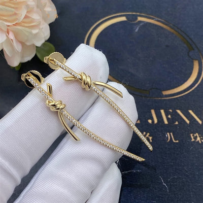 KNOT DROP EARRINGS IN GOLD WITH DIAMONDS