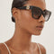 Gucci cat-eye black sunglasses with integrated GG logo