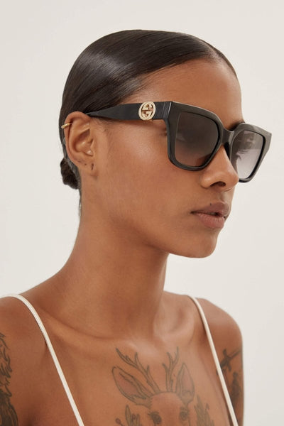 Gucci cat-eye black sunglasses with integrated GG logo - Lux Studios