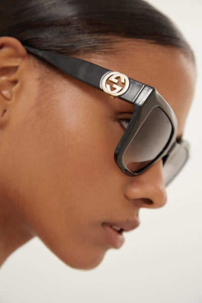 Gucci cat-eye black sunglasses with integrated GG logo - Lux Studios