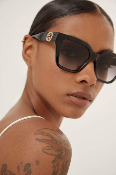 Gucci cat-eye black sunglasses with integrated GG logo - Lux Studios
