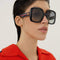 Gucci femenine oversized sunglasses with blue and red web