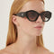 Prada oval black sunglasses featuring iconic logo