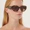 Prada oval sunglasses featuring iconic logo