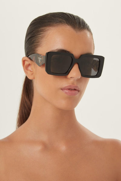 Prada squared sunglasses featuring the signature logo triangle - Lux Studios