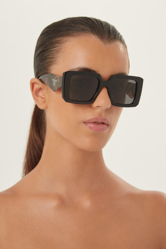 Prada squared sunglasses featuring the signature logo triangle - Lux Studios